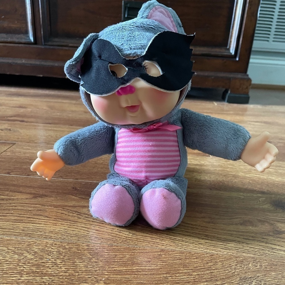 Cabbage Patch baby doll dressed as a raccoon